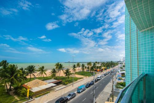 a view of the beach from a building at Hotel Corais de Tambau in João Pessoa