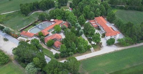 an aerial view of a house with a pond at Yannis Hotel in Krinídhes