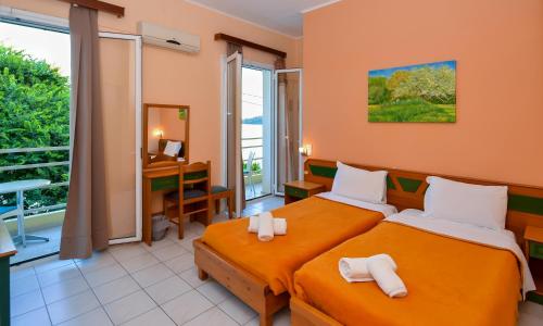 Postel nebo postele na pokoji v ubytování Costa Hotel