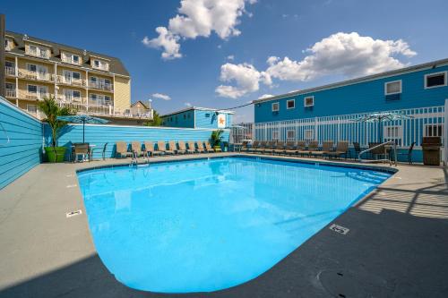 a large swimming pool in front of a building at Madison Beach Motel in Ocean City