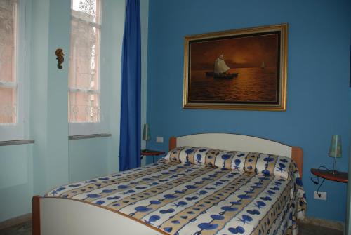 A bed or beds in a room at B&B CasettAzzurri