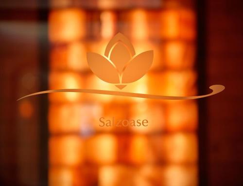 a logo of a saazote company is pictured at a store at Romantik Hotel Jagdhaus Eiden am See in Bad Zwischenahn