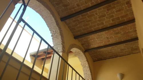 an archway in a building with a brick wall at Via Roma in Terni