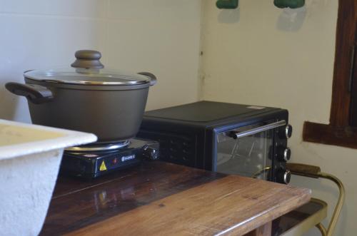 a pot on top of a stove in a kitchen at Entre Acequias in General Alvear