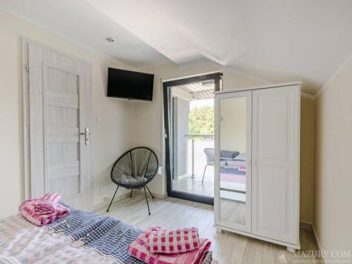 Ένα ή περισσότερα κρεβάτια σε δωμάτιο στο Wiejska 21