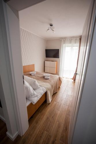 Postel nebo postele na pokoji v ubytování Apartamenty Bałtyckie - Sloneczna Oaza - Parking, Taras, Ogród, WIFI