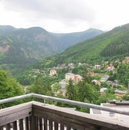 a view from a balcony of a town in the mountains at Club Alpenresidenz Gastein in Bad Gastein