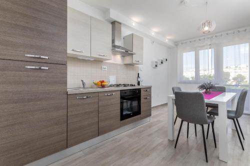 Kuchyň nebo kuchyňský kout v ubytování Apartment Sole