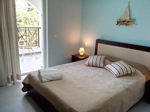 Ένα ή περισσότερα κρεβάτια σε δωμάτιο στο Anna Studios and Apartments