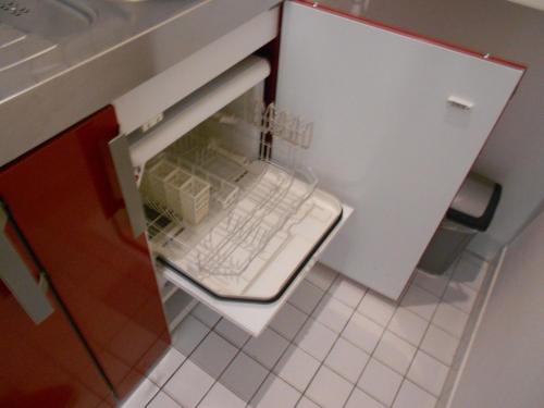an open refrigerator with a keyboard inside of it at Apartment Beethoven in Regensburg