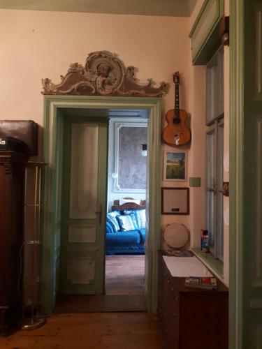 a room with a door leading to a bedroom at Rózsilak in Balatonfüred