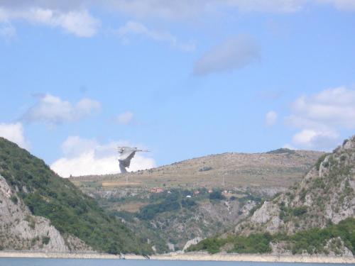 a bird perched on top of a mountain at Guest house Pribojska Banja in Pribojska Banja