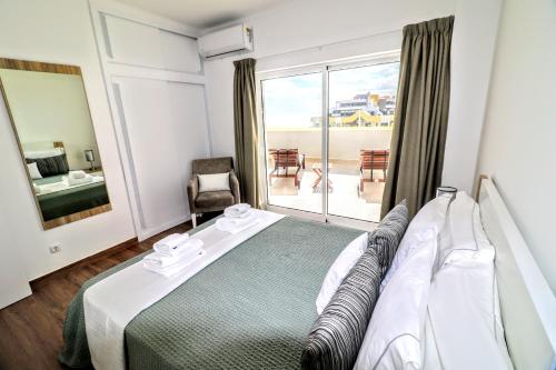 Postelja oz. postelje v sobi nastanitve By the Sea - Sea View Torres