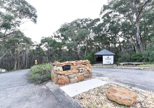 a pile of rocks sitting on the side of a road at Sinofield Edu-Retreat in Leura