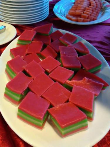 a plate of red and green squares on a table at Hotel Seri Malaysia Mersing in Mersing