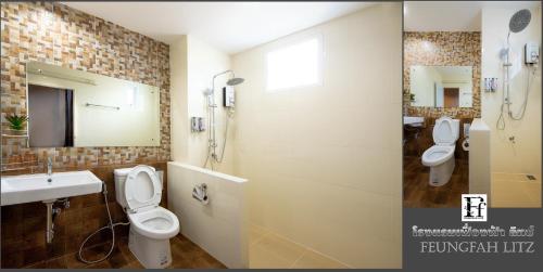 a bathroom with two toilets and a sink and a mirror at Feungfah Litz in Phetchabun