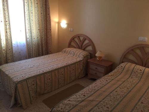 Voodi või voodid majutusasutuse villa (3 bed and 2 bath) in the Oliva Nova Golf&Beach resort toas