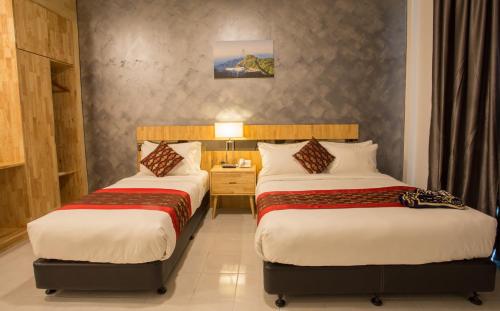 Hotel Adya Express Chenangにあるベッド