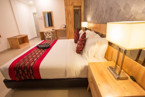 Hotel Adya Express Chenangにあるベッド