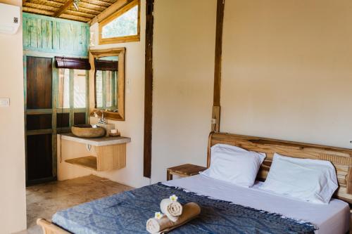 Postel nebo postele na pokoji v ubytování Kalyssa Beach Bungalows