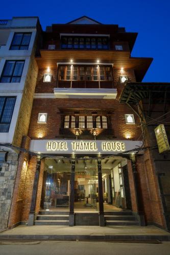 a building with a hotel triangle house at night at Hotel Thamel House - 6 km from Boudhanath Stupa, Kathmandu in Kathmandu