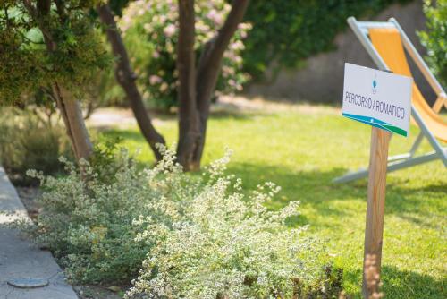 a sign for a playground in a yard at Hotel Parco Delle Agavi in Ischia