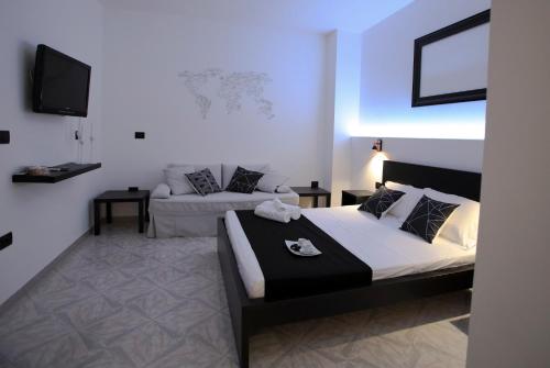 Postel nebo postele na pokoji v ubytování Il Baiocco affittacamere piscina & SPA