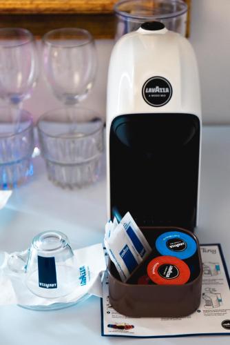 a bottle of milk and a container of toothpaste at Illyrian Boutique Hotel in Sarandë