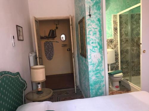 a bathroom with a shower and a toilet in a room at Casa Monica Capoliveri in Capoliveri