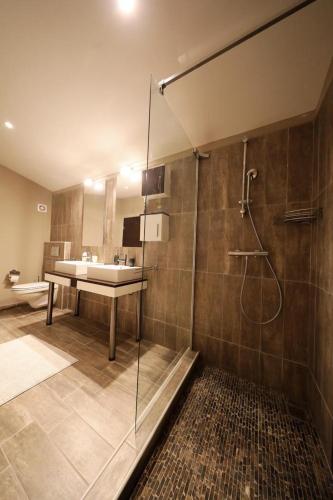 a bathroom with a shower and a sink at Luxury Apartment RougeMarin in Pakoštane