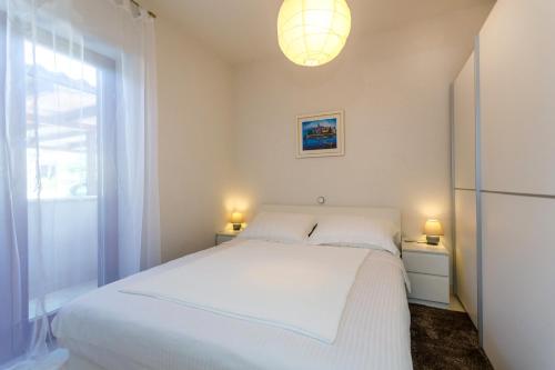 Ένα ή περισσότερα κρεβάτια σε δωμάτιο στο Apartman Ježevac