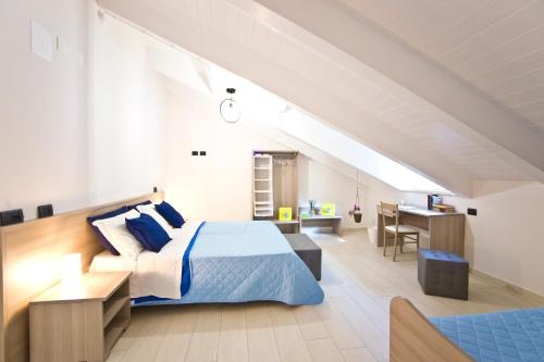 Borgo12 tesisinde bir odada yatak veya yataklar