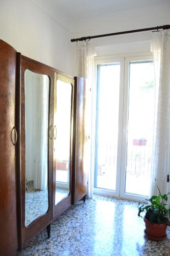 a room with a mirror and a door with windows at Villa San Giacomo in Scerni
