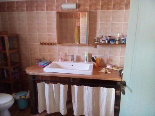 a bathroom with a sink and a toilet at Cycladic House in Vari