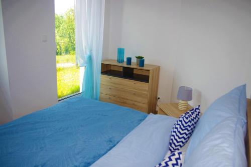 Posteľ alebo postele v izbe v ubytovaní Apartamenty PatioHoliday