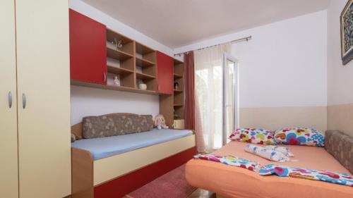 Postel nebo postele na pokoji v ubytování Apartment Ema
