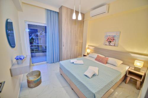 Ένα ή περισσότερα κρεβάτια σε δωμάτιο στο Aristea Apartments
