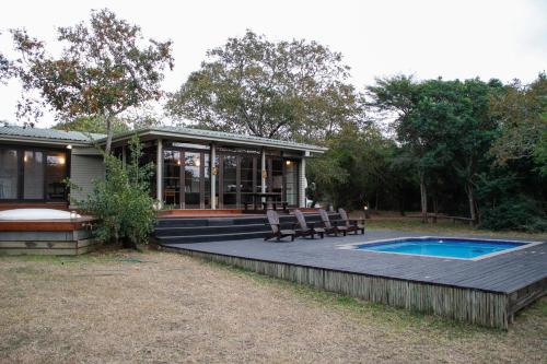 The swimming pool at or close to Khangela Private Game Lodge - Self Catering - Bedrooms are 3 Separate Chalets - Hluhluwe