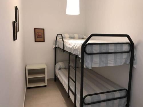 - une chambre avec 2 lits superposés dans l'établissement Preciosa duplex en el Rompido, à El Rompido