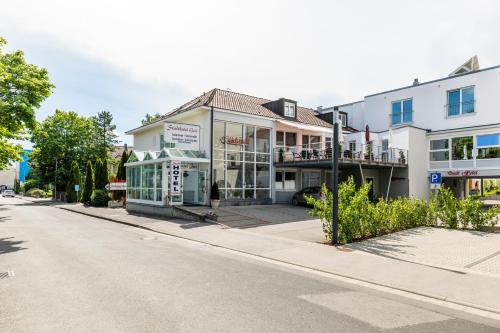 a street view of a building with a bus stop at Stadthotel Geis in Bad Neustadt an der Saale
