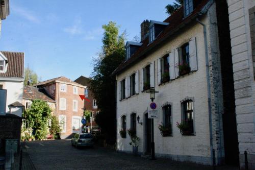 a street in a town with a white building at Het Mergelhoek 2 in Vaals