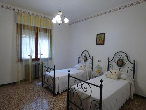 En eller flere senge i et værelse på Casa Bruna - Cipresseta del Chianti