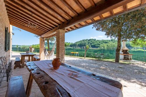 a wooden table on a patio with a view of a lake at Todi Truffle in Todi