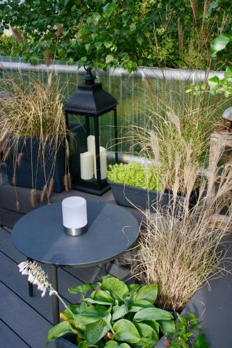 a black table with a cup on top of it at Het Mergelhoek 2 in Vaals