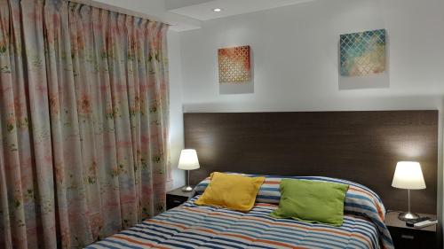 מיטה או מיטות בחדר ב-Apartamento Edificio Crucero