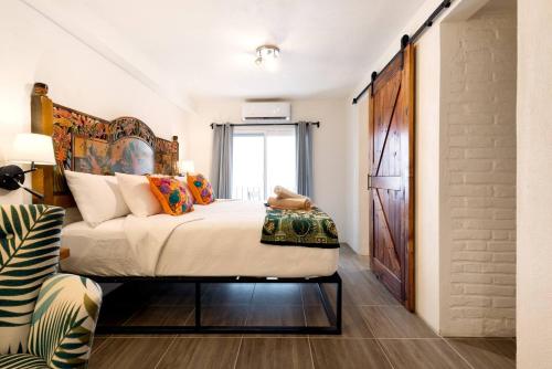 Cama o camas de una habitación en ZonaZ Boutique Hotel