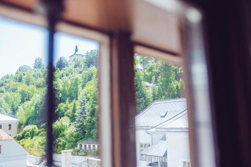 a view of a church from a window at Strieborný dvor in Banská Štiavnica