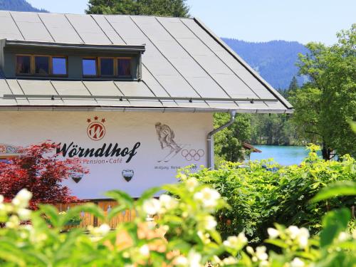 a building with a sign on the side of it at Wörndlhof - Das Refugium in Ramsau