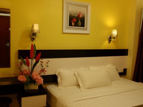 Een bed of bedden in een kamer bij Hotel Star Moon