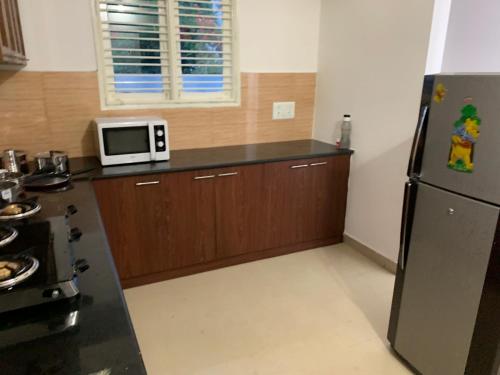 Η κουζίνα ή μικρή κουζίνα στο Sagar Niwas - Furnished short stay flats 1BHK and 2BHK